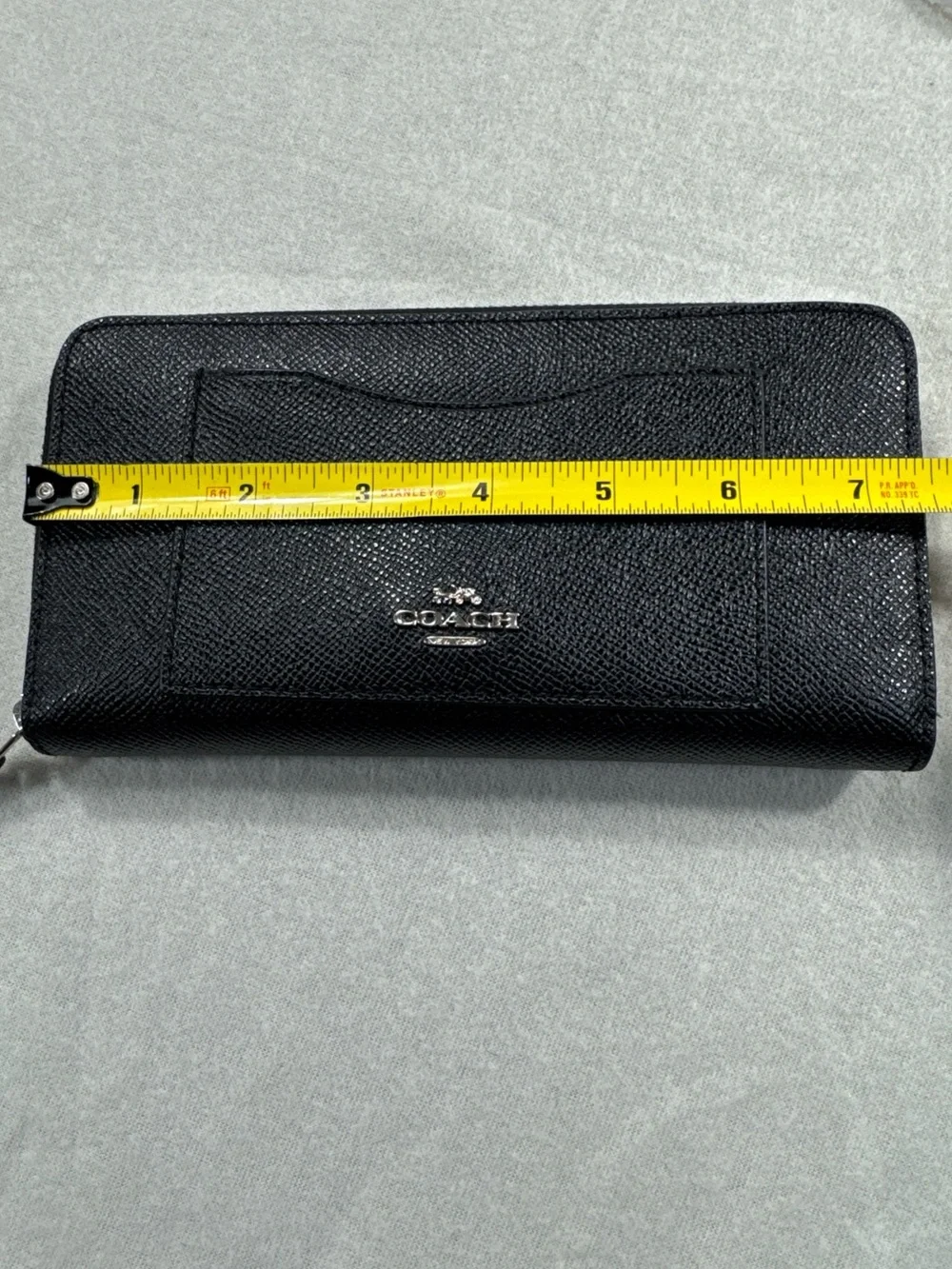Coach sleek zip